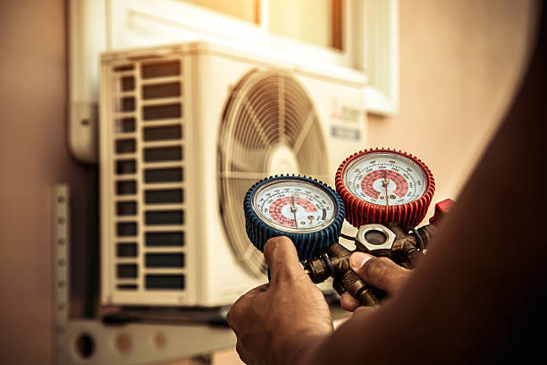 Professional Air Conditioning Service technician working in Walton, KY